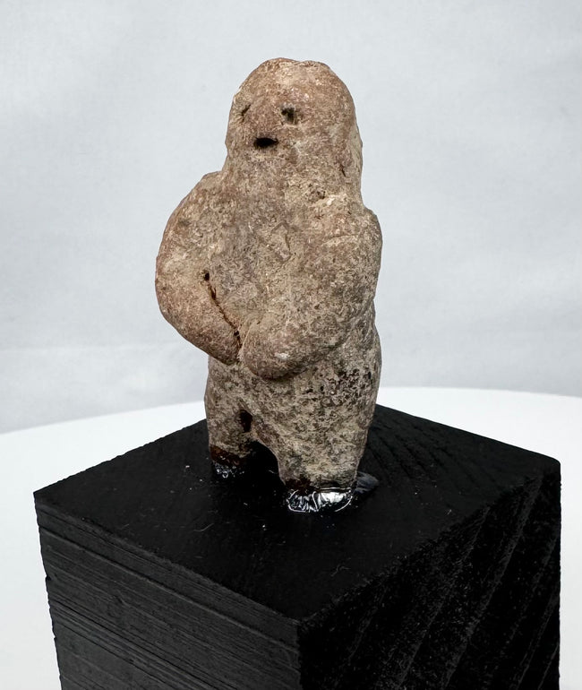 Ancient West Mexican carved stone figure with recessed eyes and small open mouth
