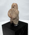 Ancient West Mexican carved stone figure with recessed eyes and small open mouth
