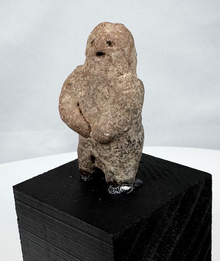 Ancient West Mexican carved stone figure with recessed eyes and small open mouth
