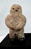 Ancient Mesoamerican stone effigy with abstract human form and weathered surface