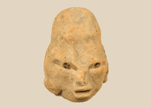 Small Pre-Columbian terracotta head fragment from West Mexico shaft-tomb culture, circa 300 BCE–300 CE, with almond-shaped eyes, defined features, and elongated cranial form, mounted on a black display base, photographed on a white background.