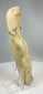 Ancient terracotta statue with stylized anatomy and worn surface