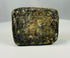 Small ancient stone plaque with rounded edges and incised decoration