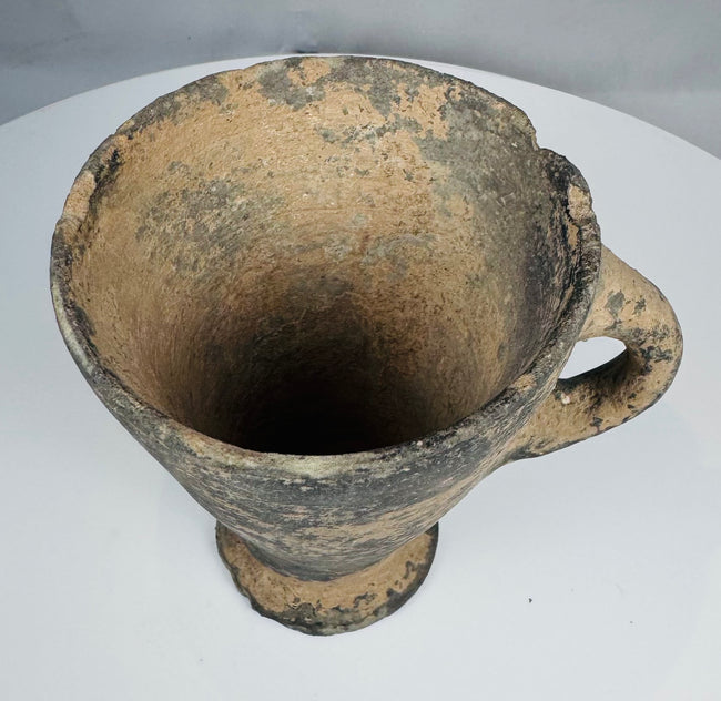 Interior view of wheel-made conical cup with visible turning marks