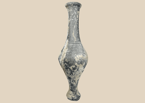 Ancient Iranian grayware spindle bottle with long neck and pedestal foot
