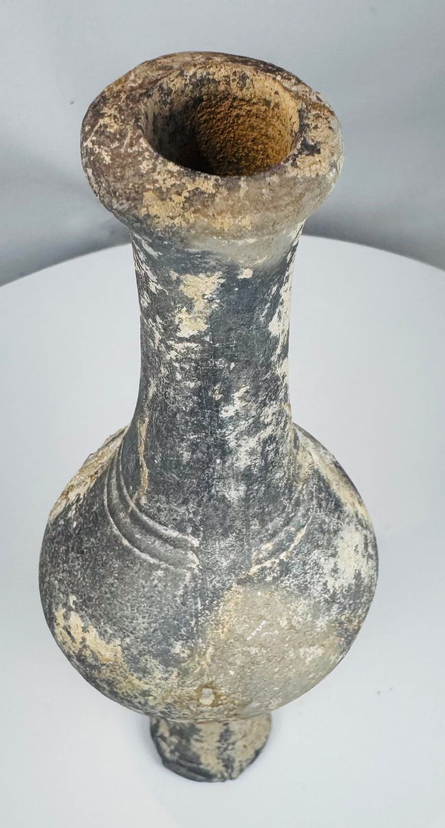 Ancient Near Eastern bottle with narrow opening for controlled dispensing