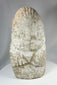 Limestone ritual figure from ancient Near East with heavy mineral deposits