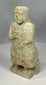 Ancient temple votive sculpture representing worshipper in prayer