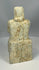 Carved stone worshipper figure with long robe and patina