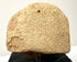 Rear view of fragmented terracotta head displaying rough porous sandy texture