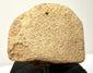 Rear view of fragmented terracotta head displaying rough porous sandy texture