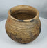 Pre-Columbian Paquimé corrugated plainware jar from the Chihuahua region of Mexico with visible firing marks and ancient craftsmanship.