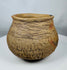 Authentic Pre-Columbian Casas Grandes earthenware vessel with corrugated bands around the shoulder and natural archaeological patina.