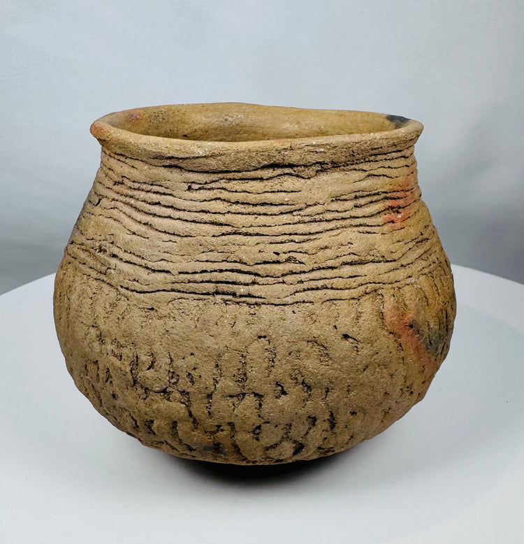Authentic Pre-Columbian Casas Grandes earthenware vessel with corrugated bands around the shoulder and natural archaeological patina.