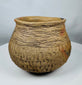 Authentic Pre-Columbian Casas Grandes earthenware vessel with corrugated bands around the shoulder and natural archaeological patina.