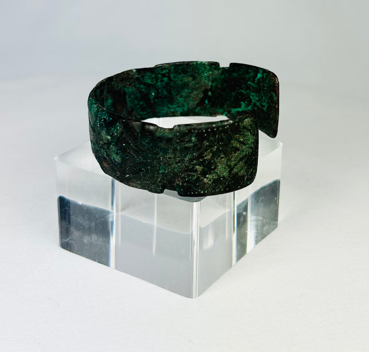 Close-up of Sassanian bronze cuff bracelet highlighting corrosion and texture