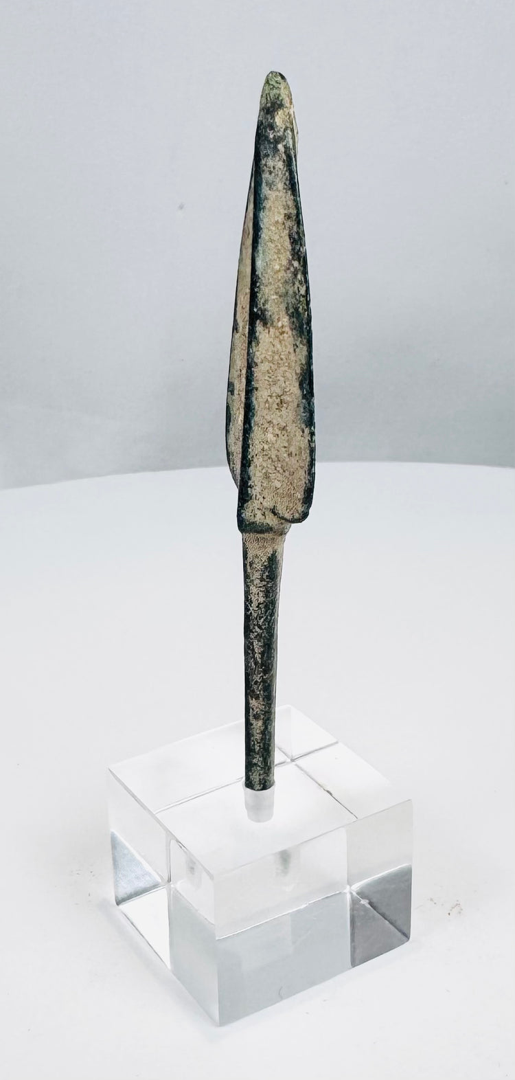 Ancient Iranian Plateau bronze weapon point mounted on a clear acrylic display base