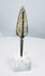 Ribbed lanceolate bronze projectile head with pale mineral encrustation