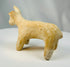 Iron Age Amlash terracotta bovine figure with compact body and raised head.