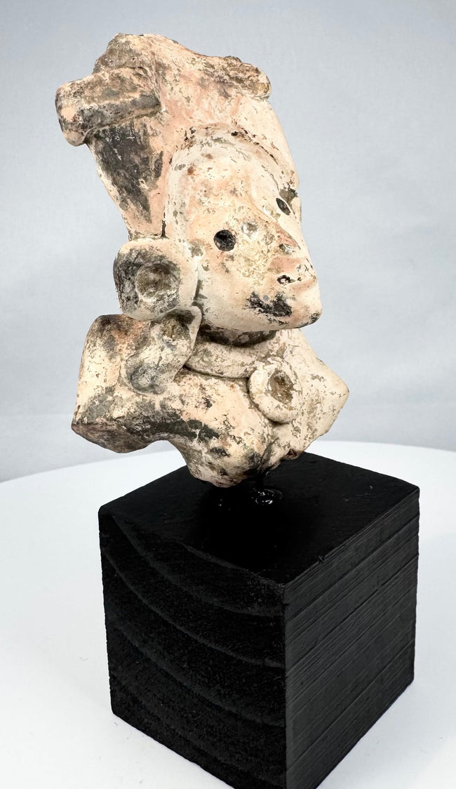 Ancient Mesoamerican funerary figure fragment with earthen encrustation and mineral deposits