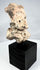 Ancient Mesoamerican funerary figure fragment with earthen encrustation and mineral deposits