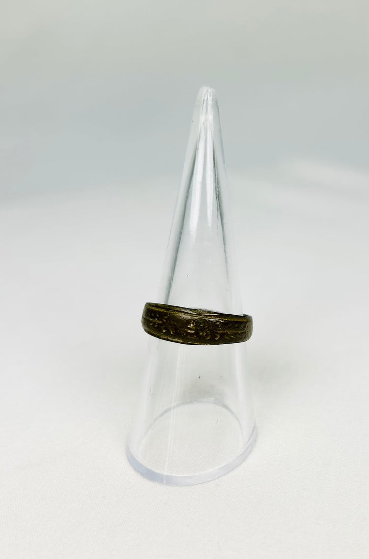 Ancient Roman ring worn as symbol of status or identity with decorative engraving