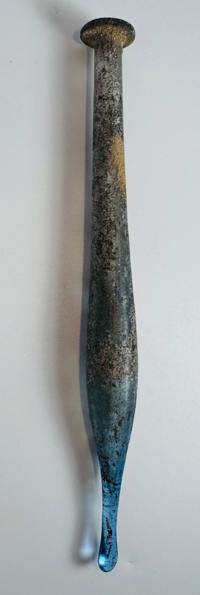 Ancient Roman candlestick-form glass container traditionally used for perfumes and medicinal substances
