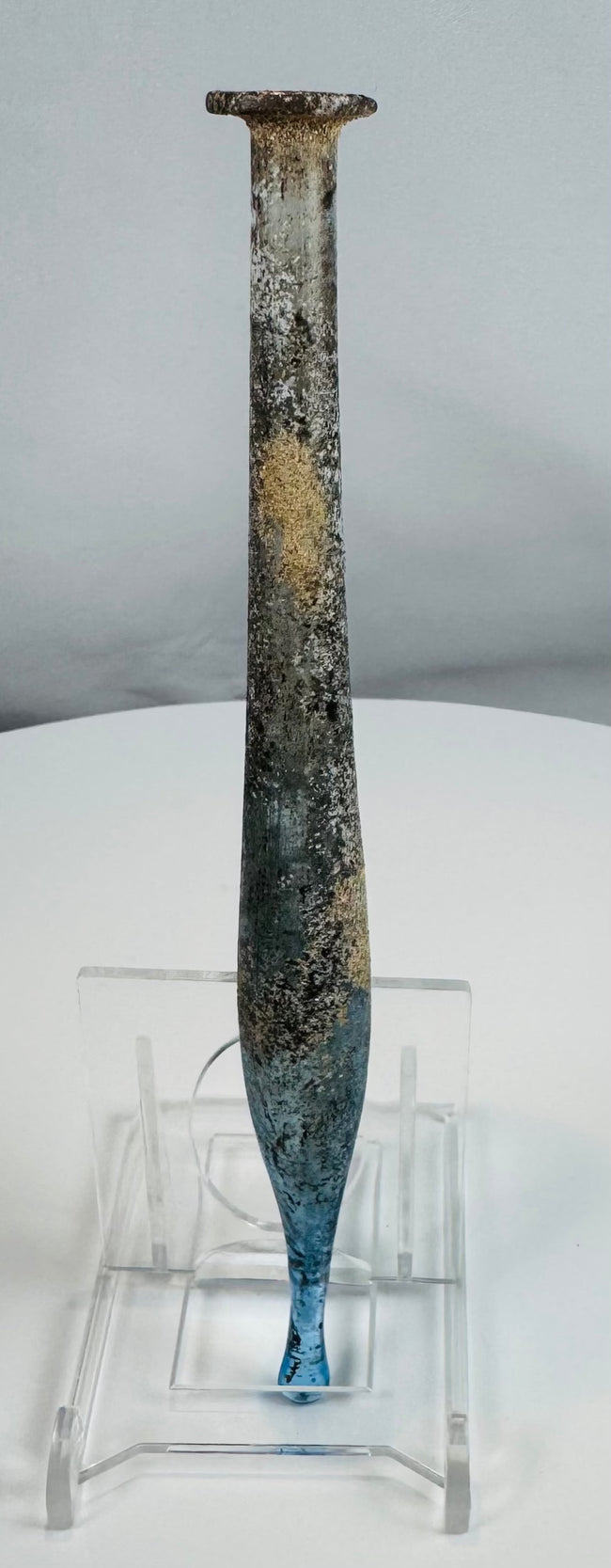 Roman blue glass unguentarium with elegant elongated profile and authentic burial patina