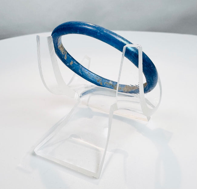 Roman Empire glass bracelet with smooth rounded profile and vivid cobalt-blue appearance.