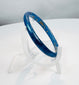Historic Roman blue glass bracelet preserved with minor surface deposits and archaeological character.