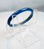 Ancient Roman blue glass jewelry artifact showcasing early glassmaking technology and design.