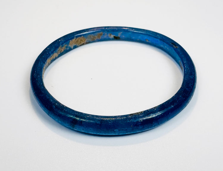 Collector-quality Roman cobalt-blue glass bracelet exhibiting excellent preservation and vibrant color.