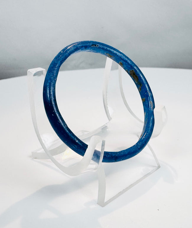 Ancient Roman personal adornment made from cobalt-blue glass, dating to the 1st–4th century AD.