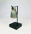 Ancient Roman cast bronze bell from 1st–4th century CE with looped suspension handle and aged patina.