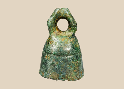 Ancient Roman cast bronze bell, 1st–4th century CE, with suspension loop, rich green patina, and mounted display stand.