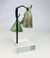 Archaeological Roman bronze bell artifact with green and brown patina from long burial