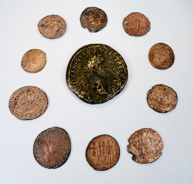 Ancient Roman Imperial coin collection with one large bronze coin and nine smaller Late Roman issues displaying portraits and reverse designs.