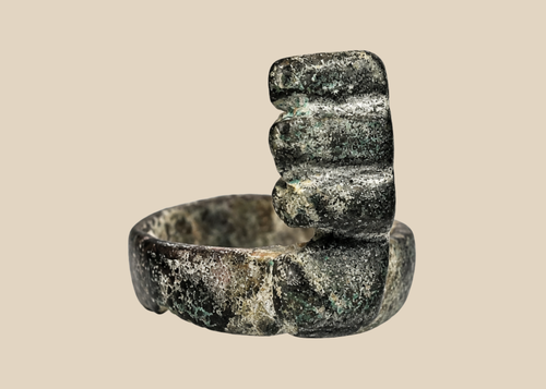 Ancient Roman bronze ring key from the 3rd–4th century CE with an integral toothed key bit and green-brown patina