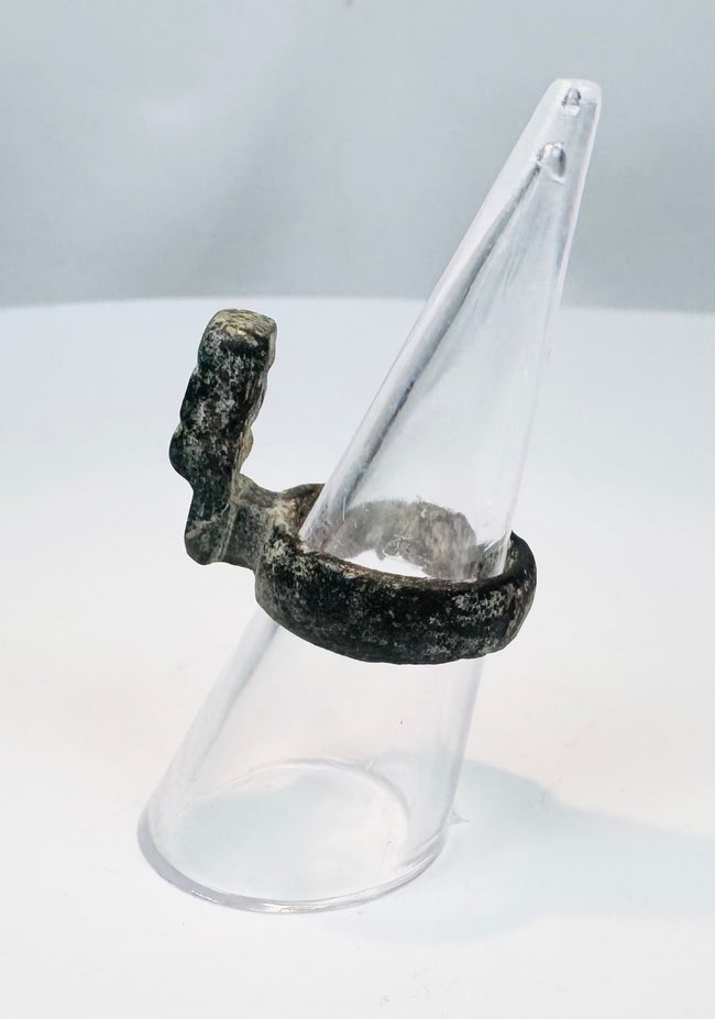 Roman bronze ring key displaying dark green patination, oxidation, and mineral encrustation