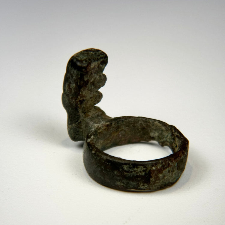 Ancient 3rd–4th century Roman bronze ring key showing extensive patination and preserved stepped key bit