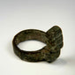 Ancient Roman ring key combining a circular bronze finger hoop with a functional locking mechanism