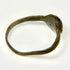 Close detail of blue glass cabochon mounted in an ancient bronze Roman ring bezel