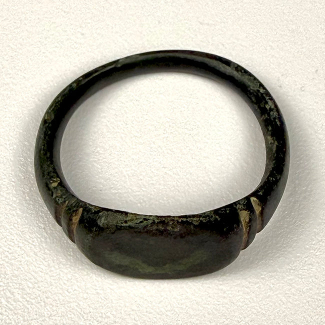 Detail view of Roman Imperial bronze finger ring showing surface pitting, oxidation, and mineral encrustation