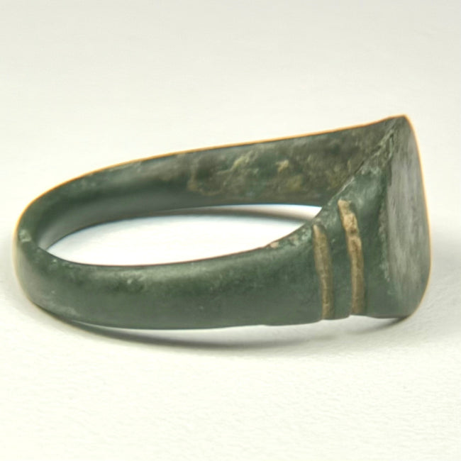 Underside of Roman bronze finger ring with complete rounded hoop and naturally aged archaeological surface