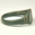 Underside of Roman bronze finger ring with complete rounded hoop and naturally aged archaeological surface