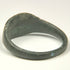 Ancient Roman copper-alloy finger ring with broad oval face and double transverse shoulder grooves