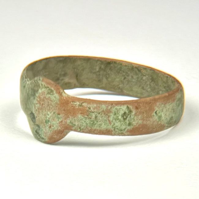 Ancient Roman bronze finger ring with broad flat band and plain circular-to-oval integral bezel