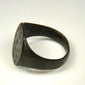 Roman period bronze ring with preserved engraved dot-and-circle motifs and rich archaeological patina