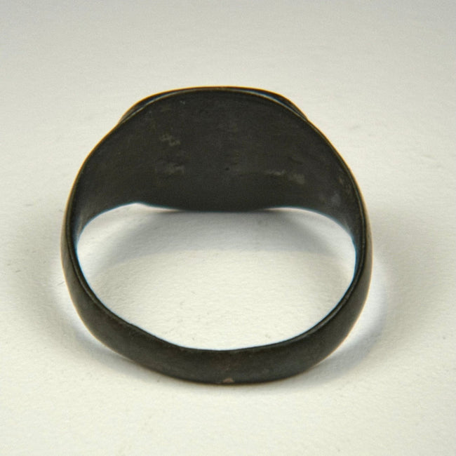 Ancient bronze jewelry from the Roman Empire with decorated flat bezel and centuries-old surface wear