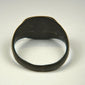Ancient bronze jewelry from the Roman Empire with decorated flat bezel and centuries-old surface wear